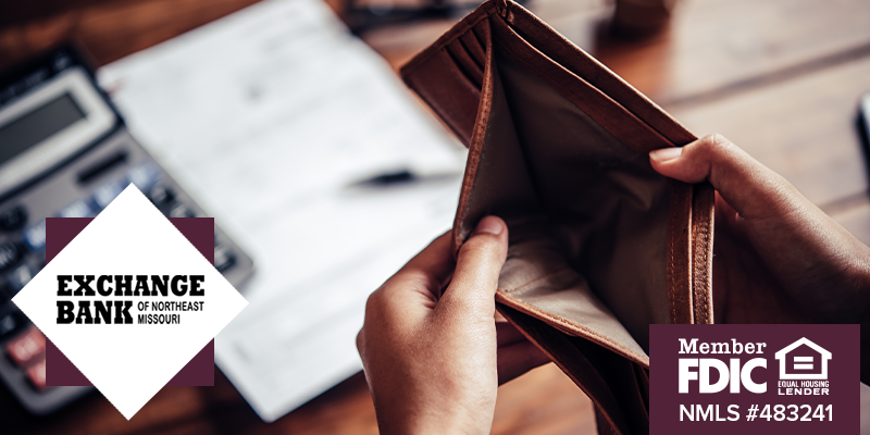 Close up shot of hands holding up an empty wallet